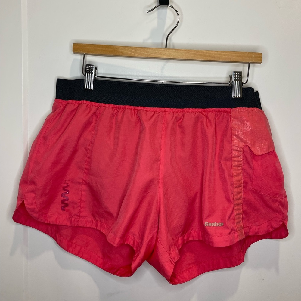 Reebok woman’s running short with pocket size large pink and black